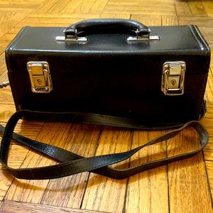 Vintage leather rectangular handbag or makeup case.
